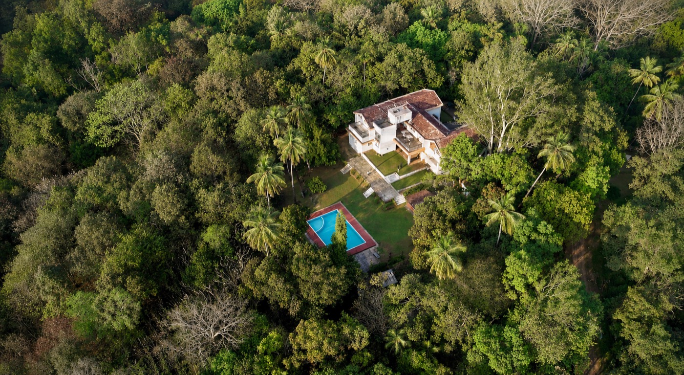 Big the Bungalow drone shot with pool and estate visible