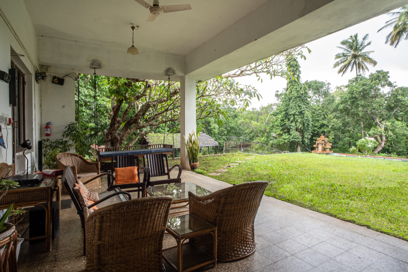 Covered veranda with garden view at Big the Bungalow