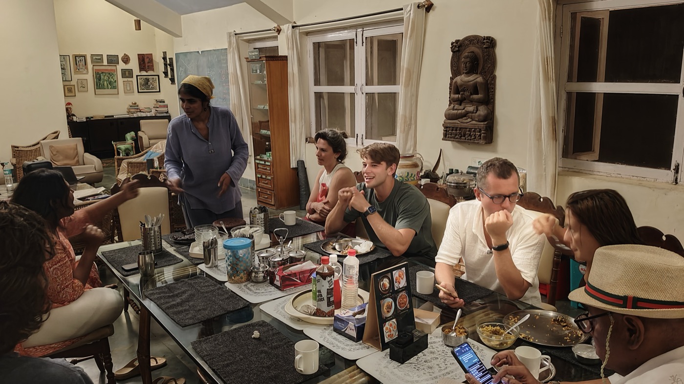 Residents laughing at the communal dinner table