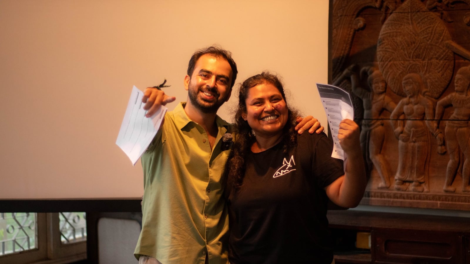 Divi with a Jungli resident, laughing after a workshop on campus