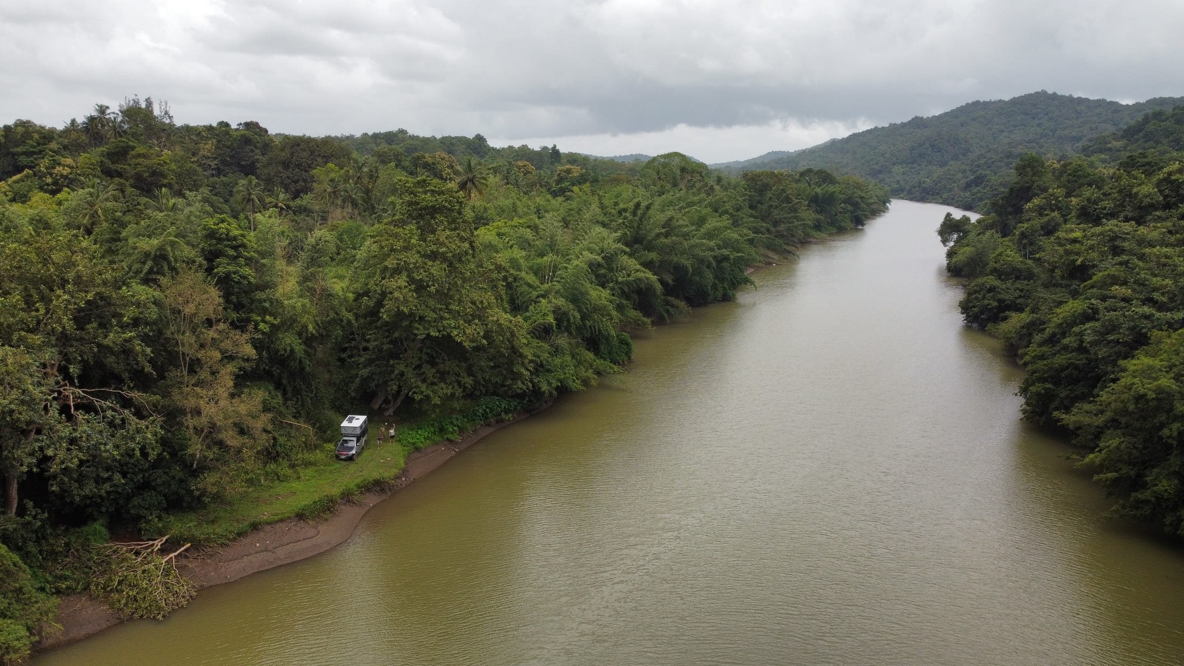 Aerial of the Kali River winding through forested hills