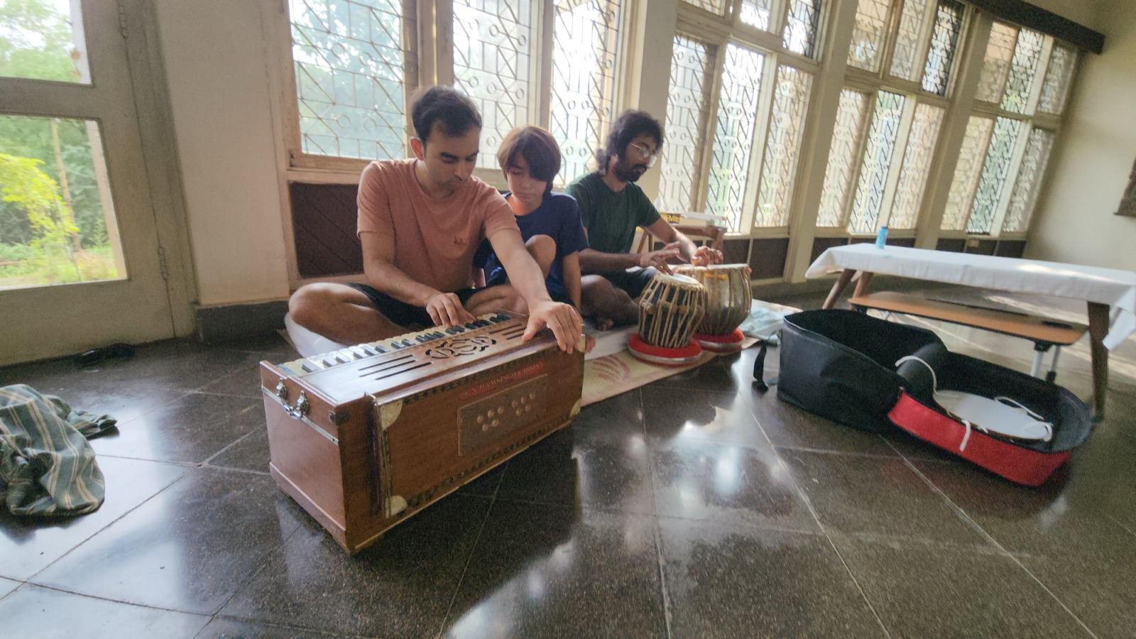 A harmonium and tabla lesson in the old factory hall