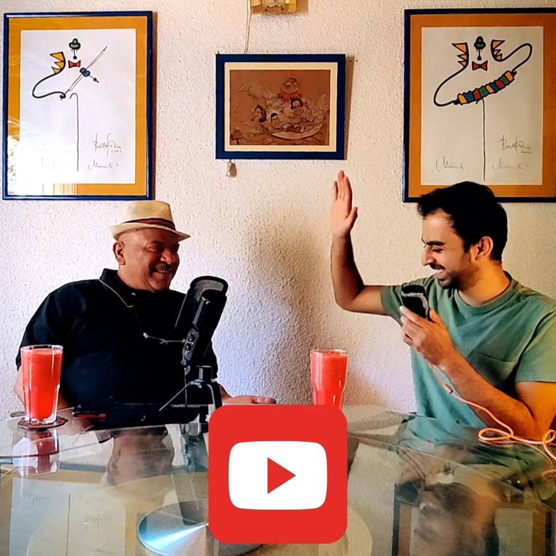 Poppa Schae and Divi high-fiving while recording the story of the land