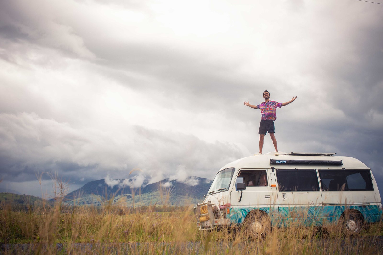 Divi on the roof of his campervan in the Australian hills