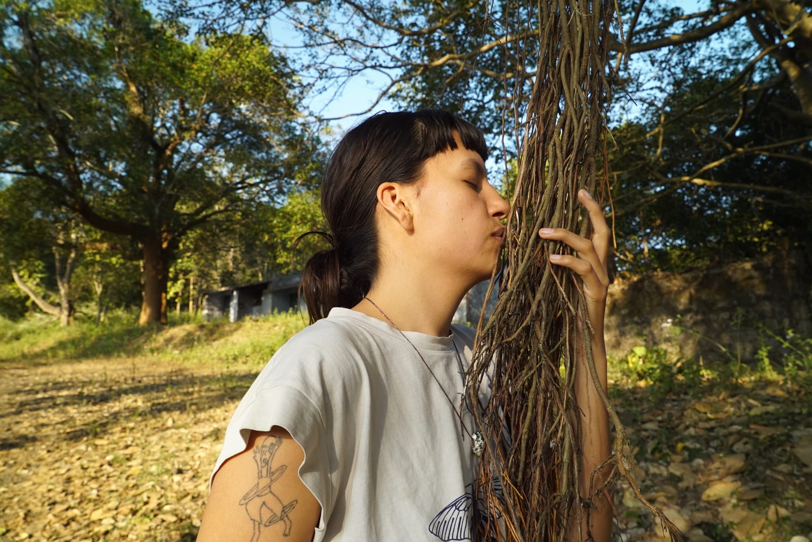 A resident embracing the trees at Jungli